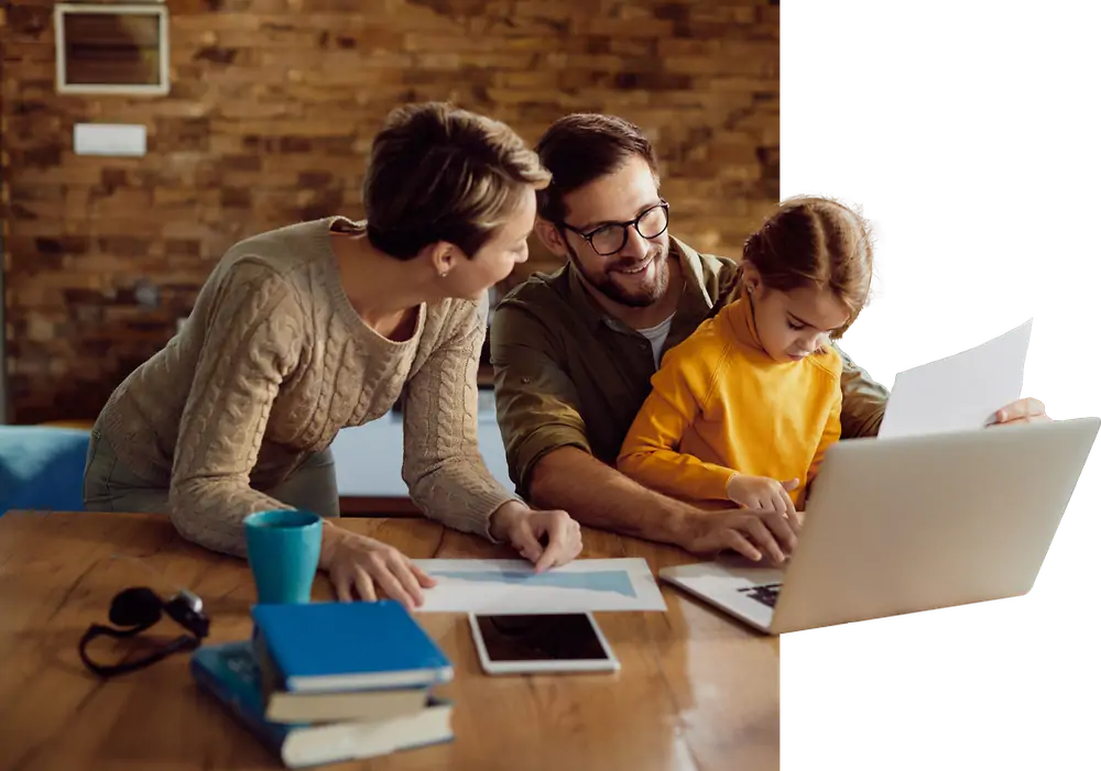 happy working father using laptop with his family home