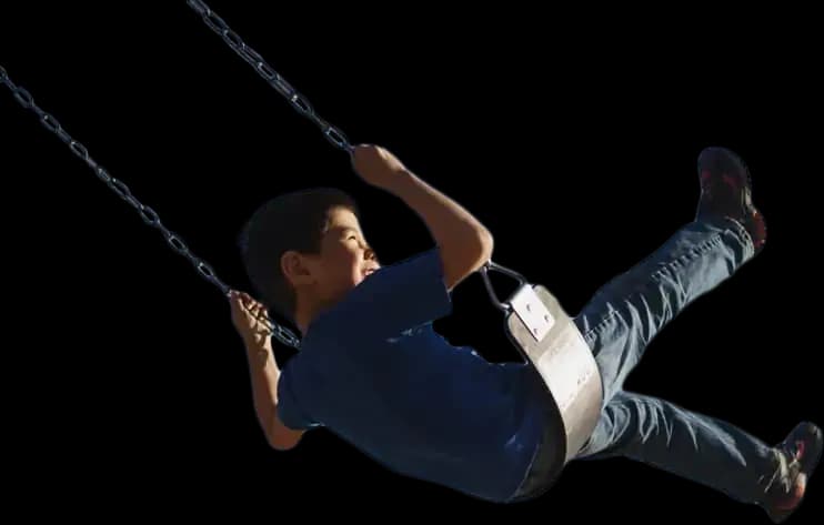 Young boy swinging