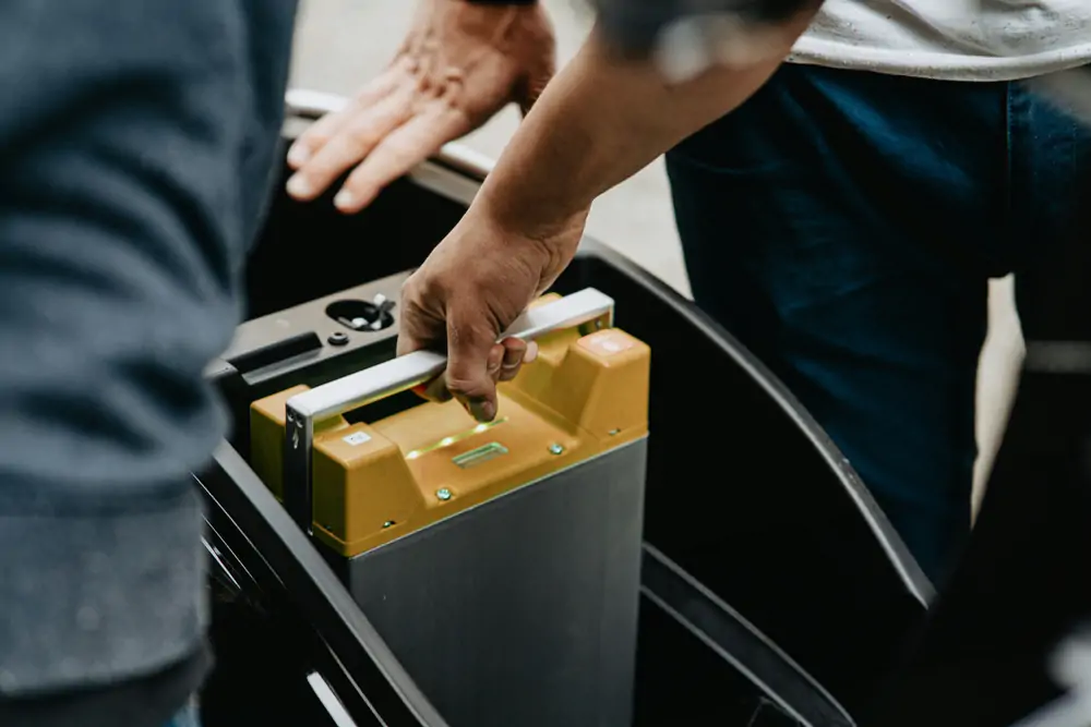 man installing battery storage